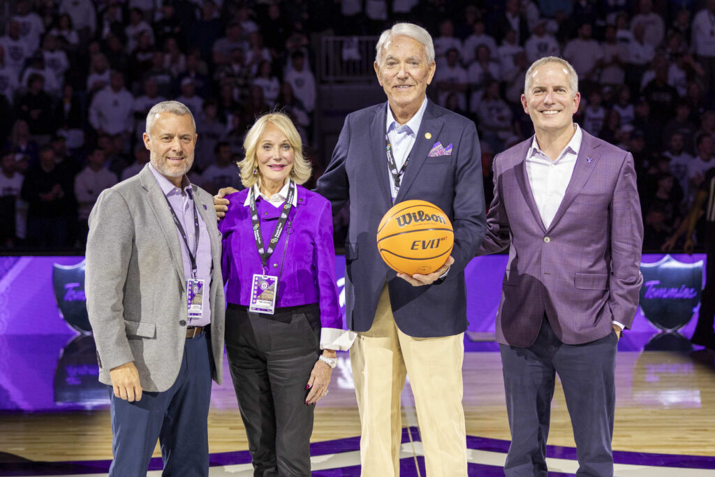 Phil Esten with benefactors Penny and Lee Anerson and Rob Vischer take center court at opening home game.