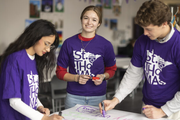 Three students standings and working on arts and crafts in create[space].