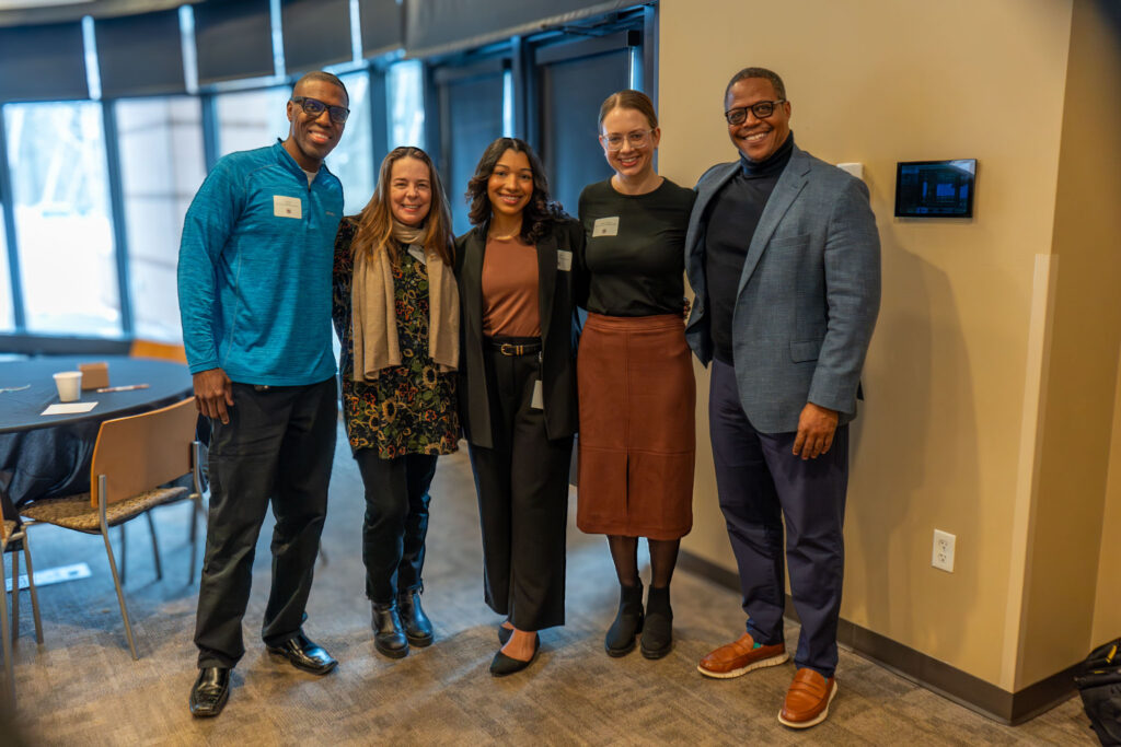 A group of guests pose for a photo.