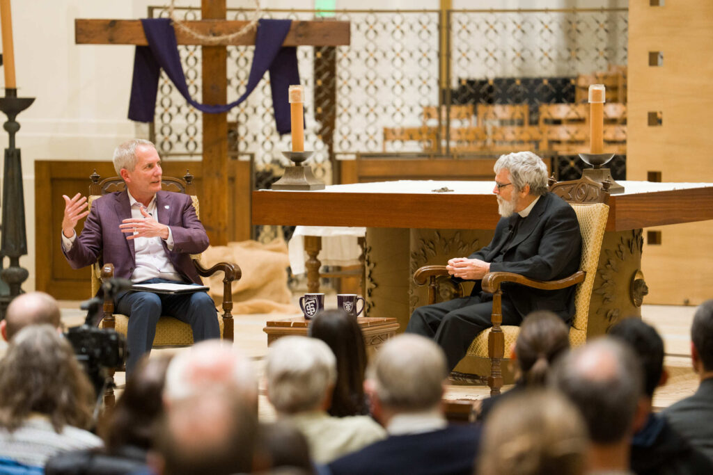 President Rob Vischer engages Astronomer Brother Guy Consolmagno