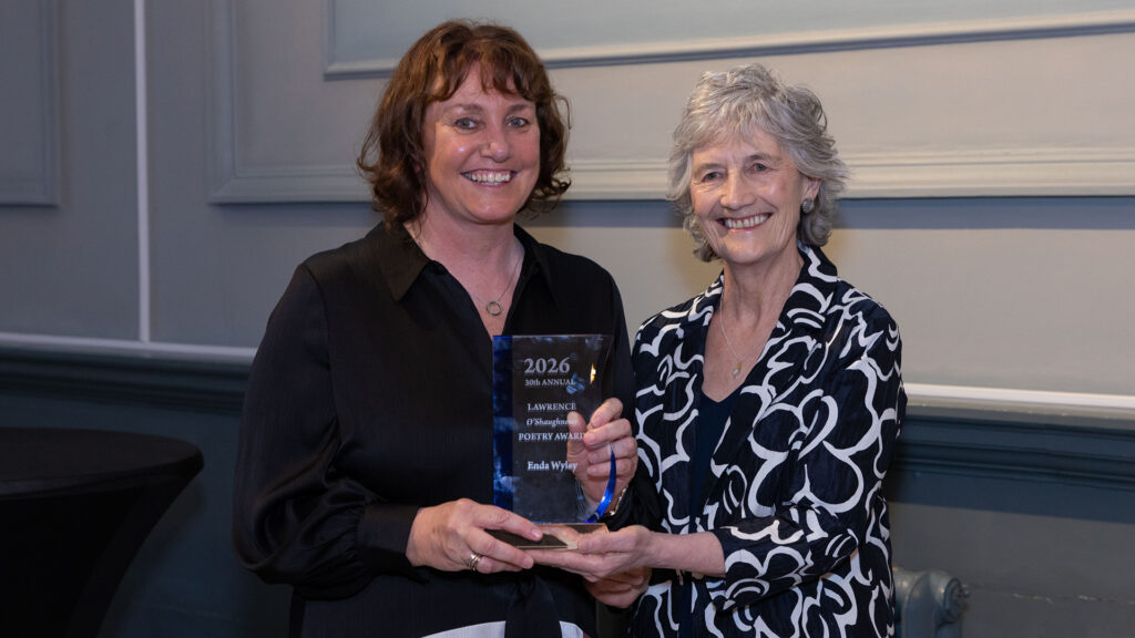 Enda Wyley poses with Catherine Connolly, the President of Ireland, after receiving the Lawrence O'Shaughnessy Award for Poetry