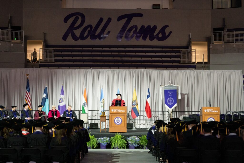 keynote speaker talking to crowd during commencement