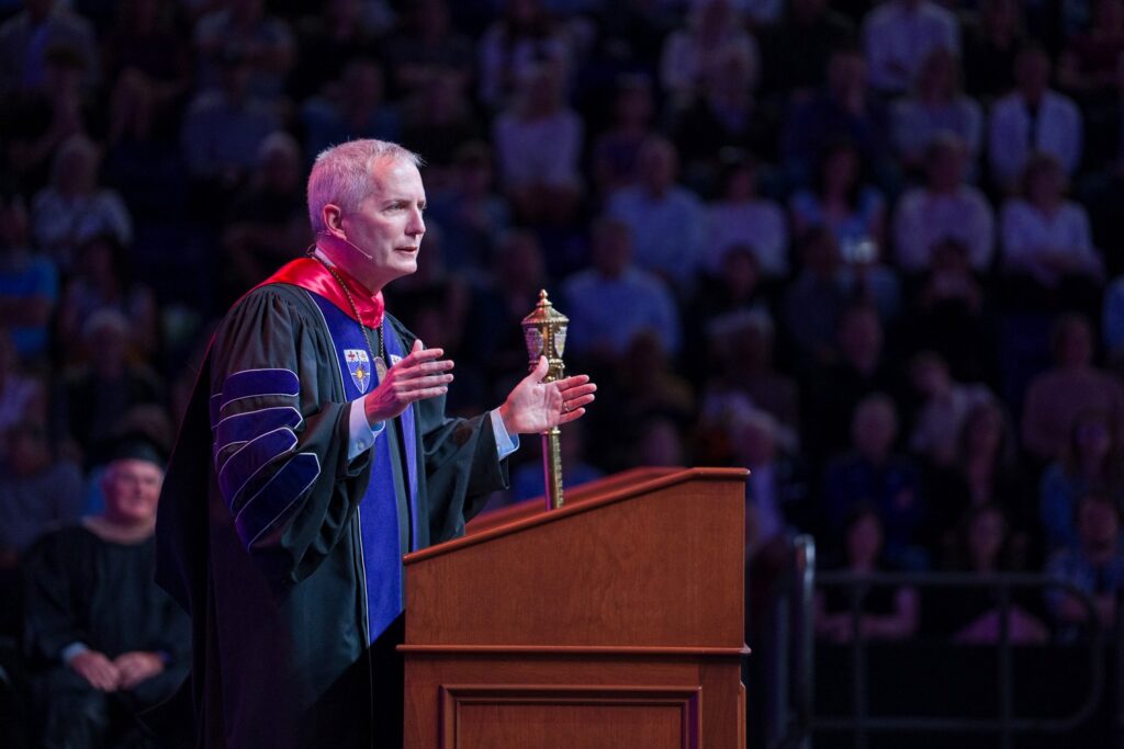 Rob Vischer speaks during the 2026 Opus College of Business Commencement Ceremony at Lee & Penny Anderson Arena in St. Paul on May 23, 2026.