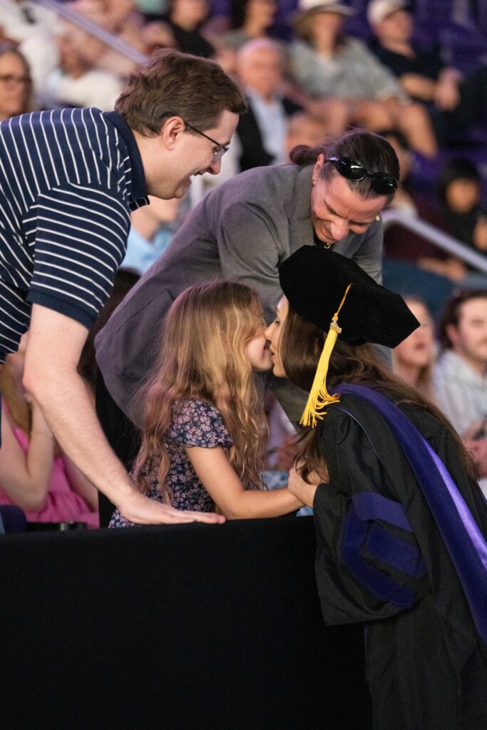 Student celebrates with family