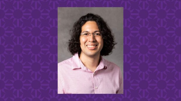 Alex Barrios smiles for a photo. There is a purple St. Thomas graphic that serves as a background.