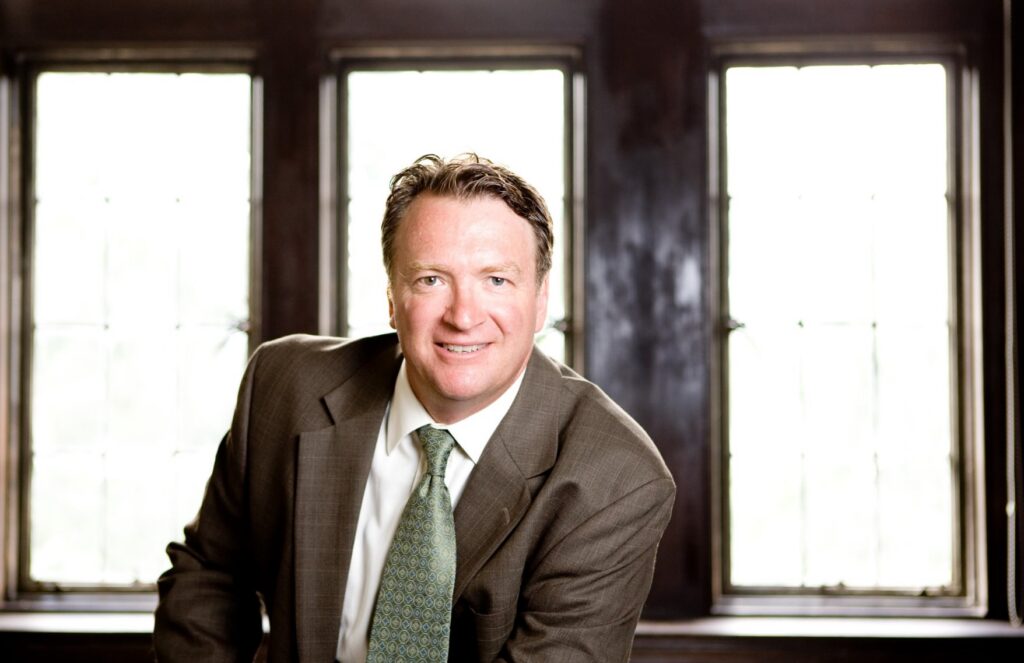 A portrait of Dean Don Weinkauf smiling ahead.
