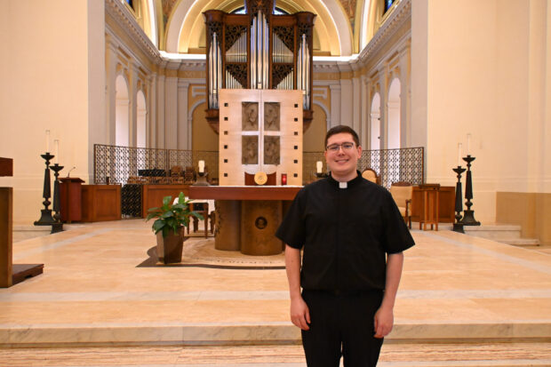 Father Nathan smiles for a photo.