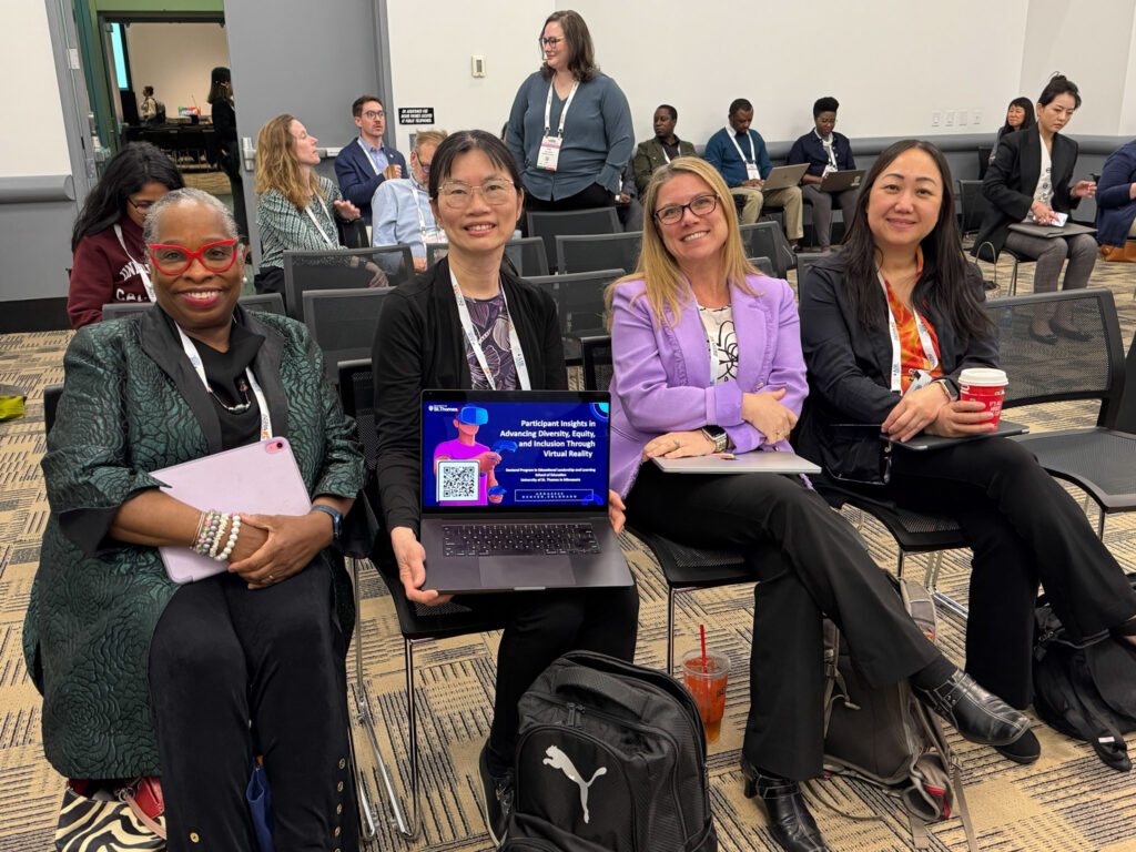 Candace Chou sitting alongside three collaborators a part of her research.