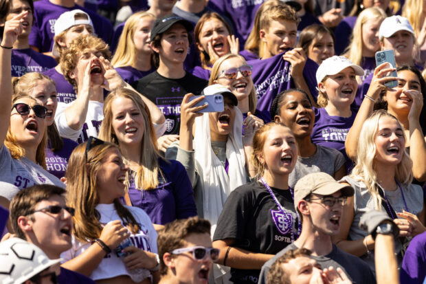 A crowd of St. Thomas students in a fan section.