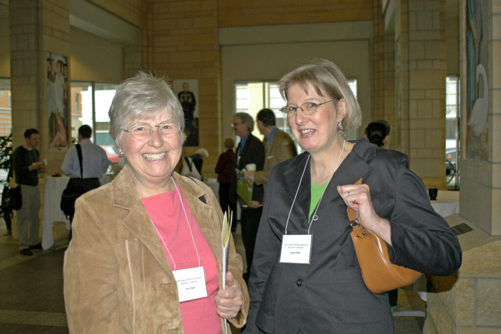 Dr. Kay Egan and Laura Hutt pose for a photo while standing side by side.