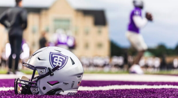 St. Thomas football helmet in the end zone.