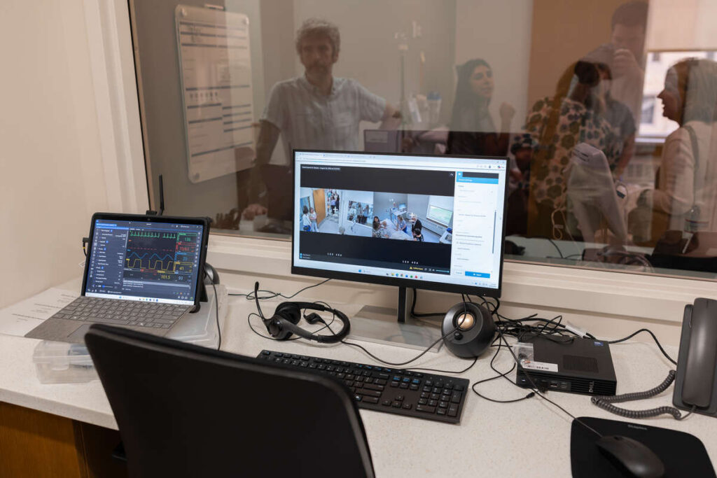 Attendees tour the learning center and simulation lab.