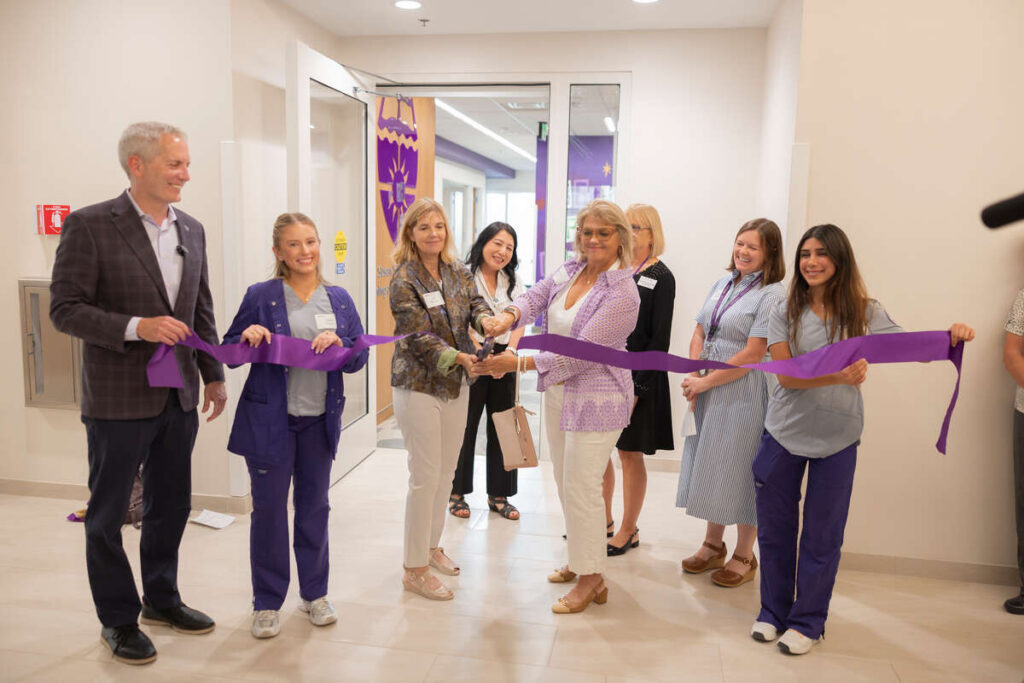 Participants cut the ribbon at the new simulation center.