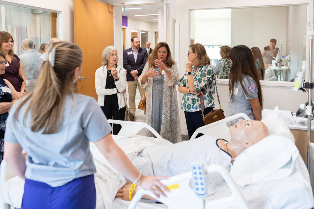 Students demonstrating the new nursing simulation lab.
