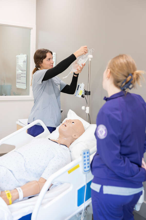 Nursing students demonstrating new simulation lab.
