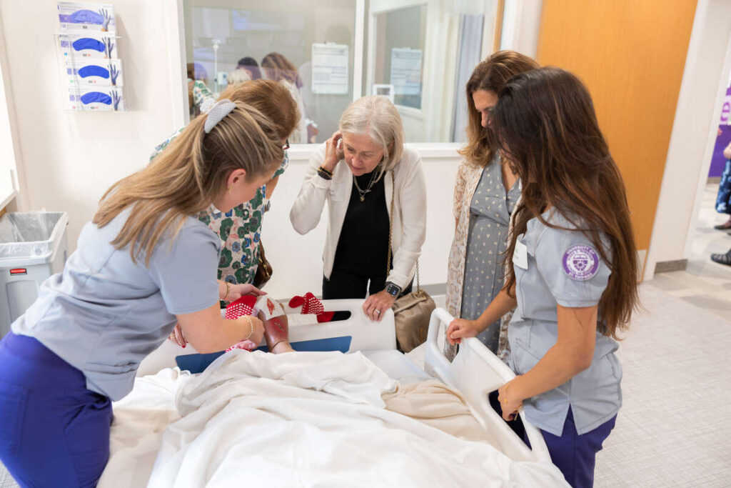 Students demonstrating simulation lab technology.