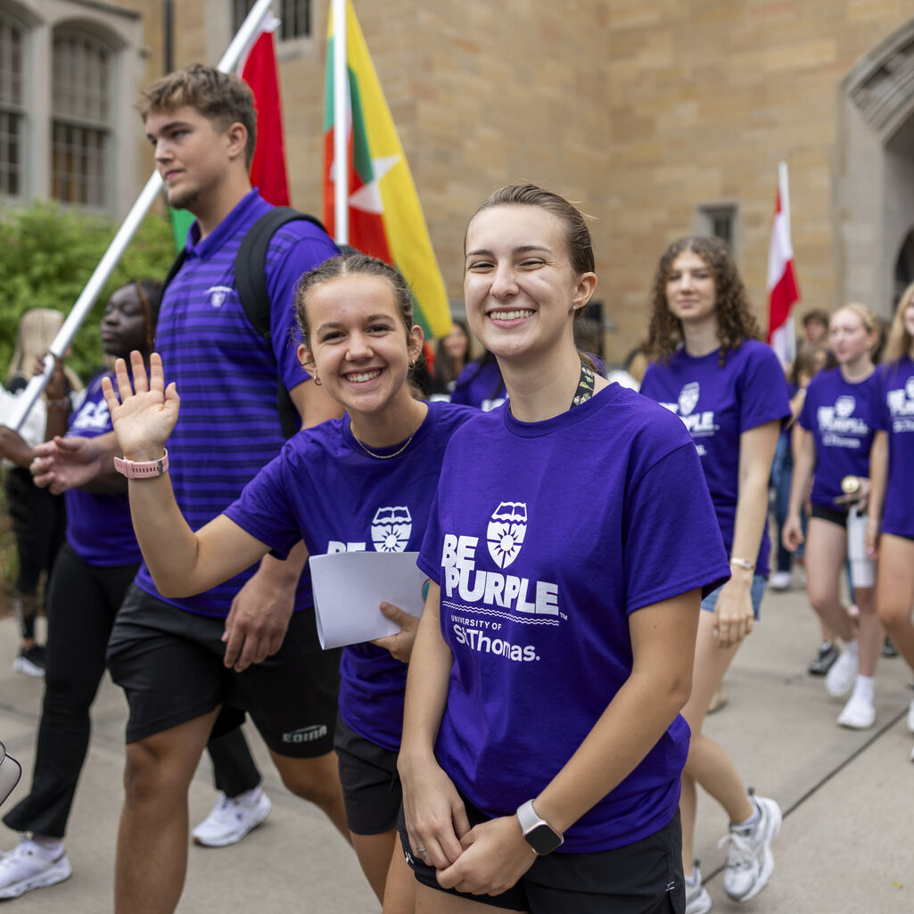 Two students smile for a photo.