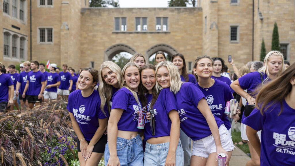 A group of students smile for a photo.