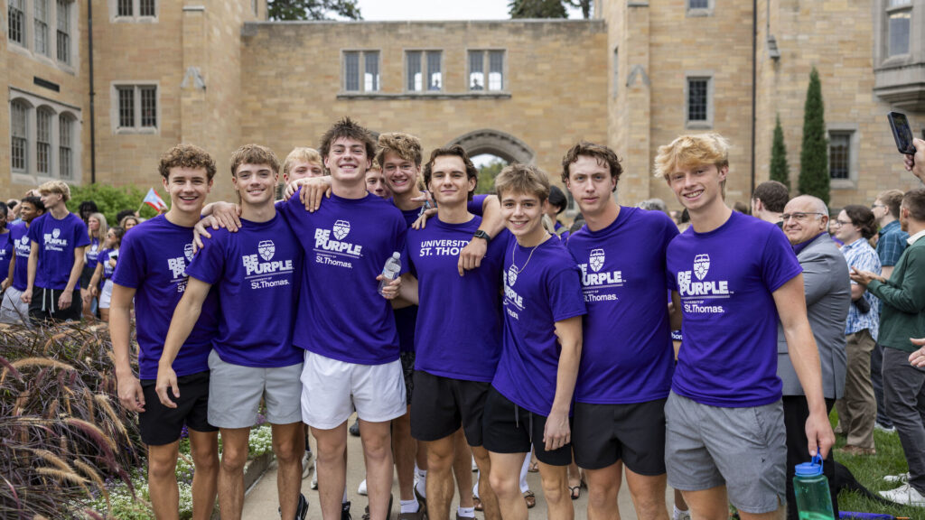 A group of students smile for a photo.