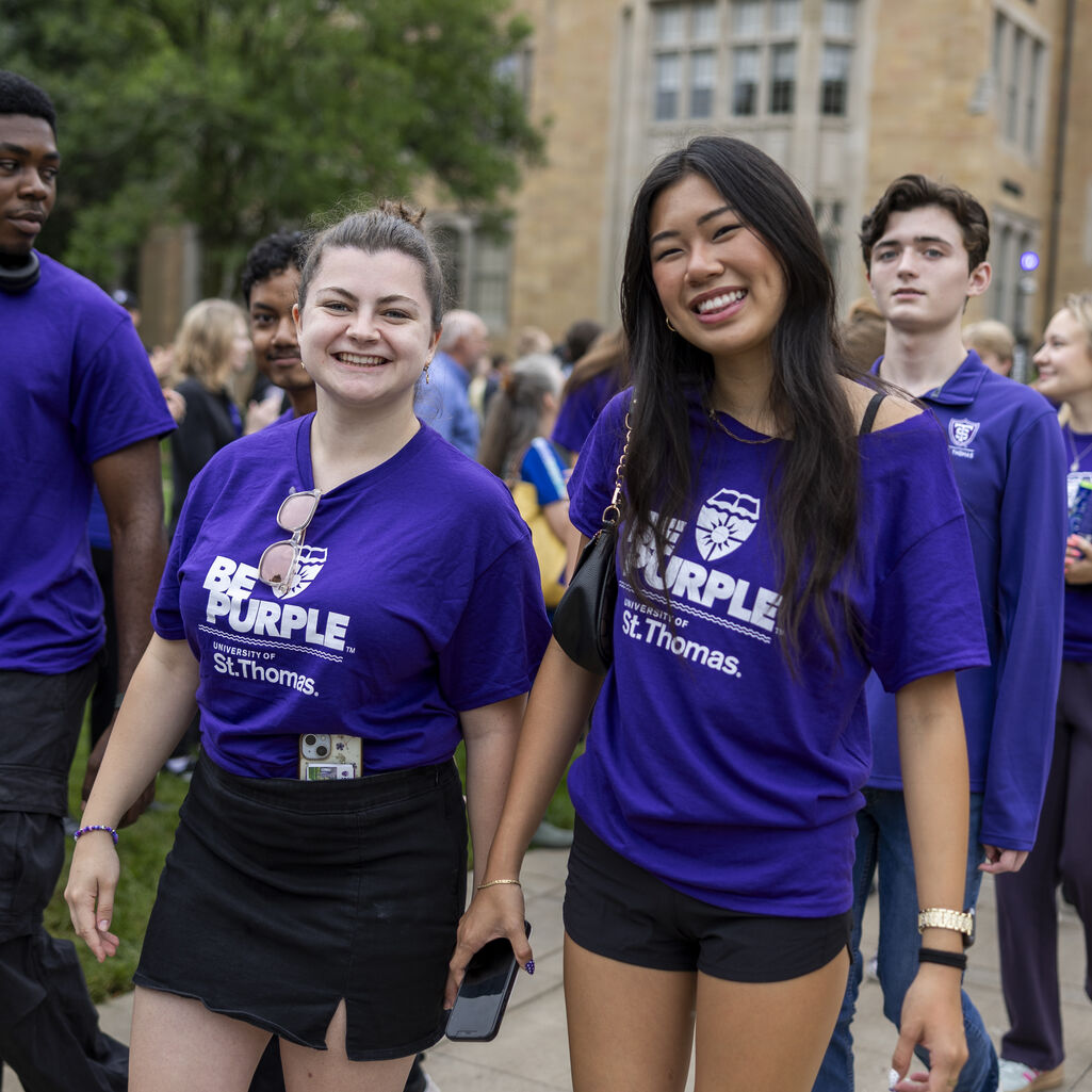 Two students smile for a photo.