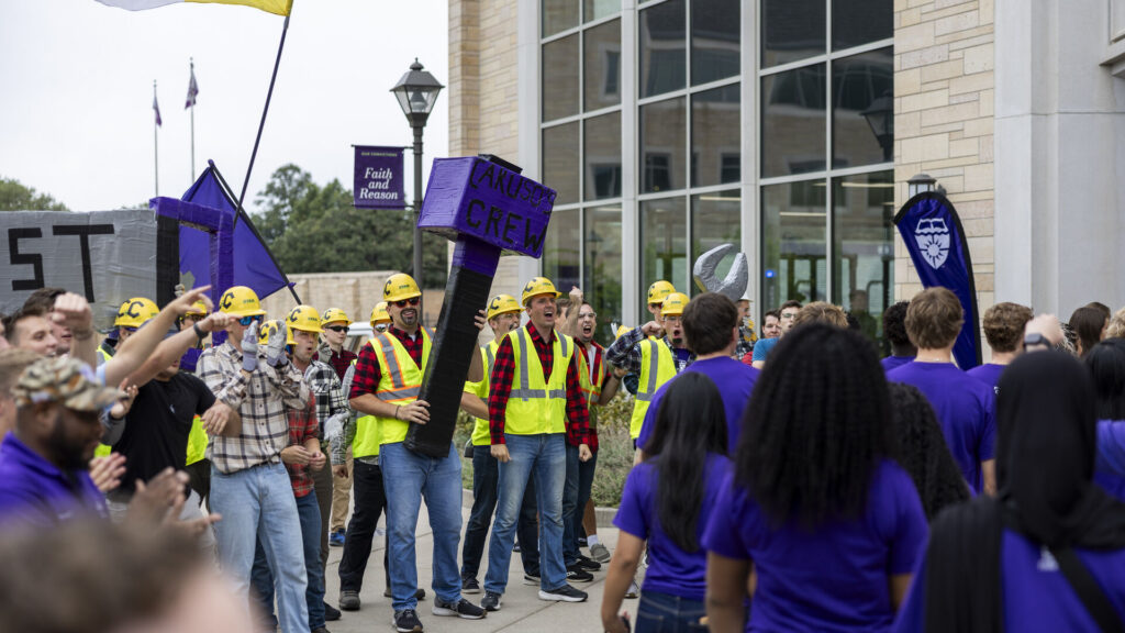 Caruso’s Crew hyping up students as they walk through the Arches.