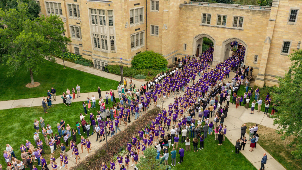 A sea of students walking through The Arches.
