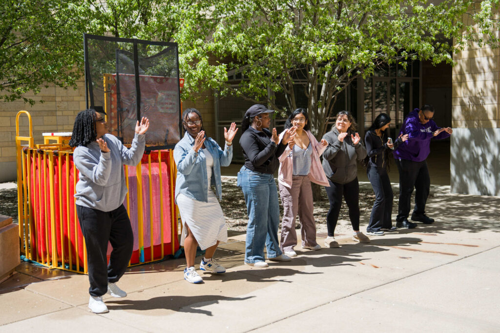 Six DFC students and Dean Buffy Smith celebrate at DFC block party.