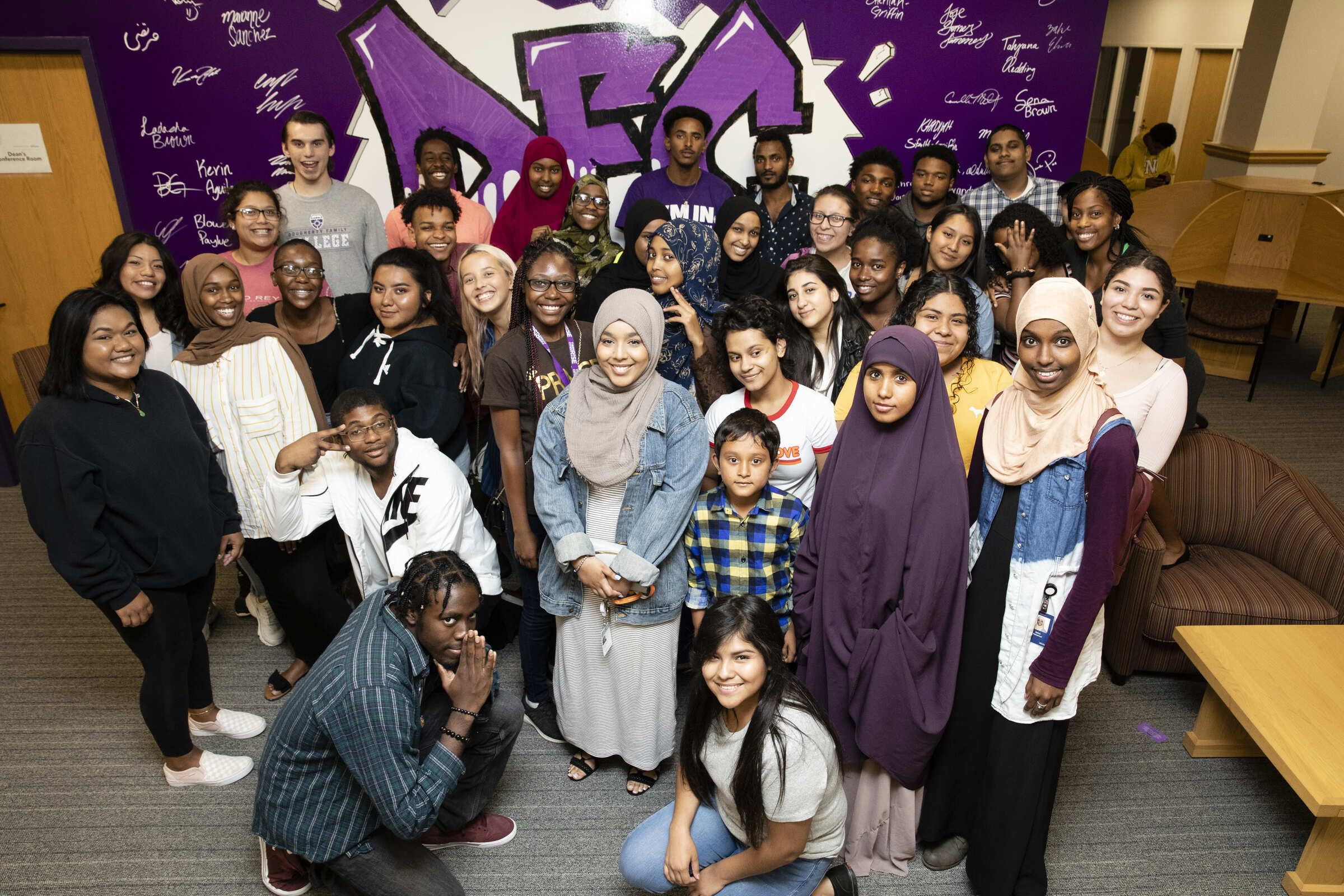 DFC students by DFC mural