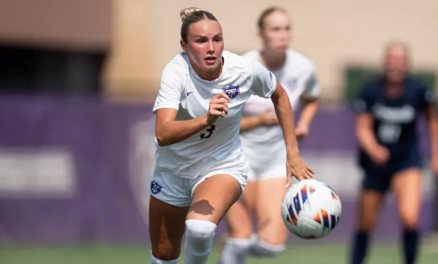 Melina Knowles running down the soccer field.