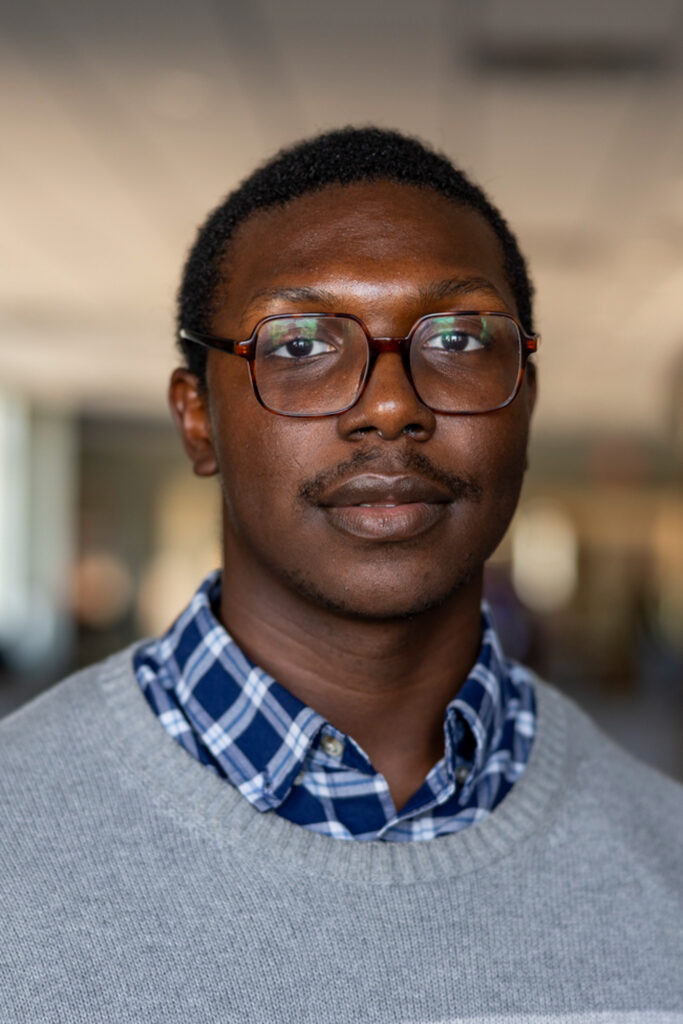 Theodes R.E. Saine poses for a portrait.