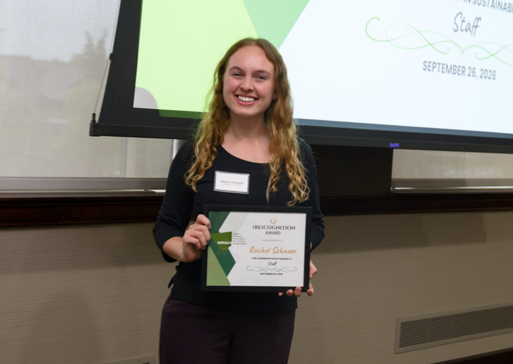 Rachel Schauer receiving the 2026 Staff Member (Re)Cognition Award from the Upper Midwest Association for Campus Sustainability (UMACS).