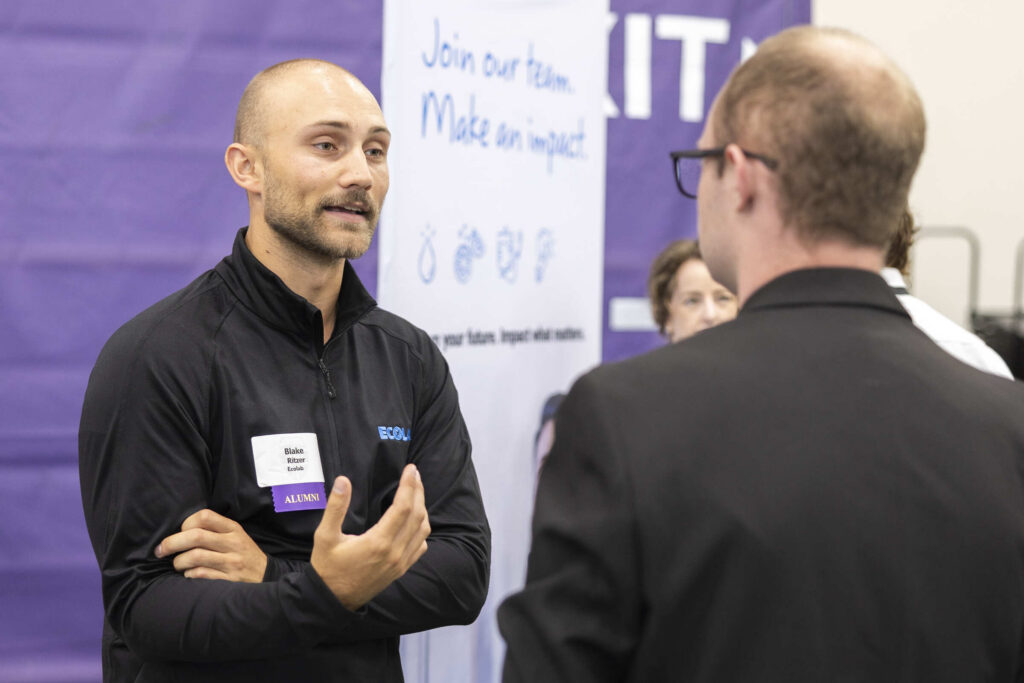 Recruiter and student talking at Career Fair Fall 2026