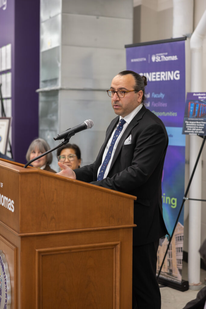 Mahmoud Kabalan speaks at the podium.