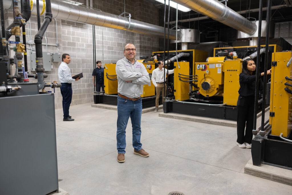 Mahmoud Kabalan poses with equipment in new microgrid.