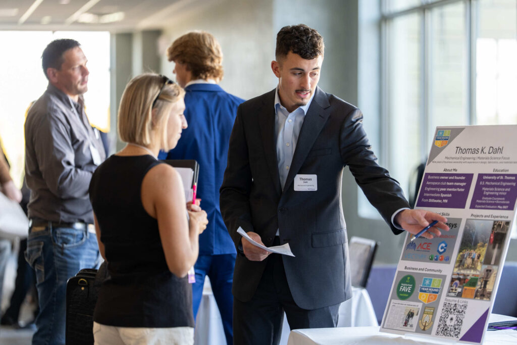 A student speaking with a recruiter.