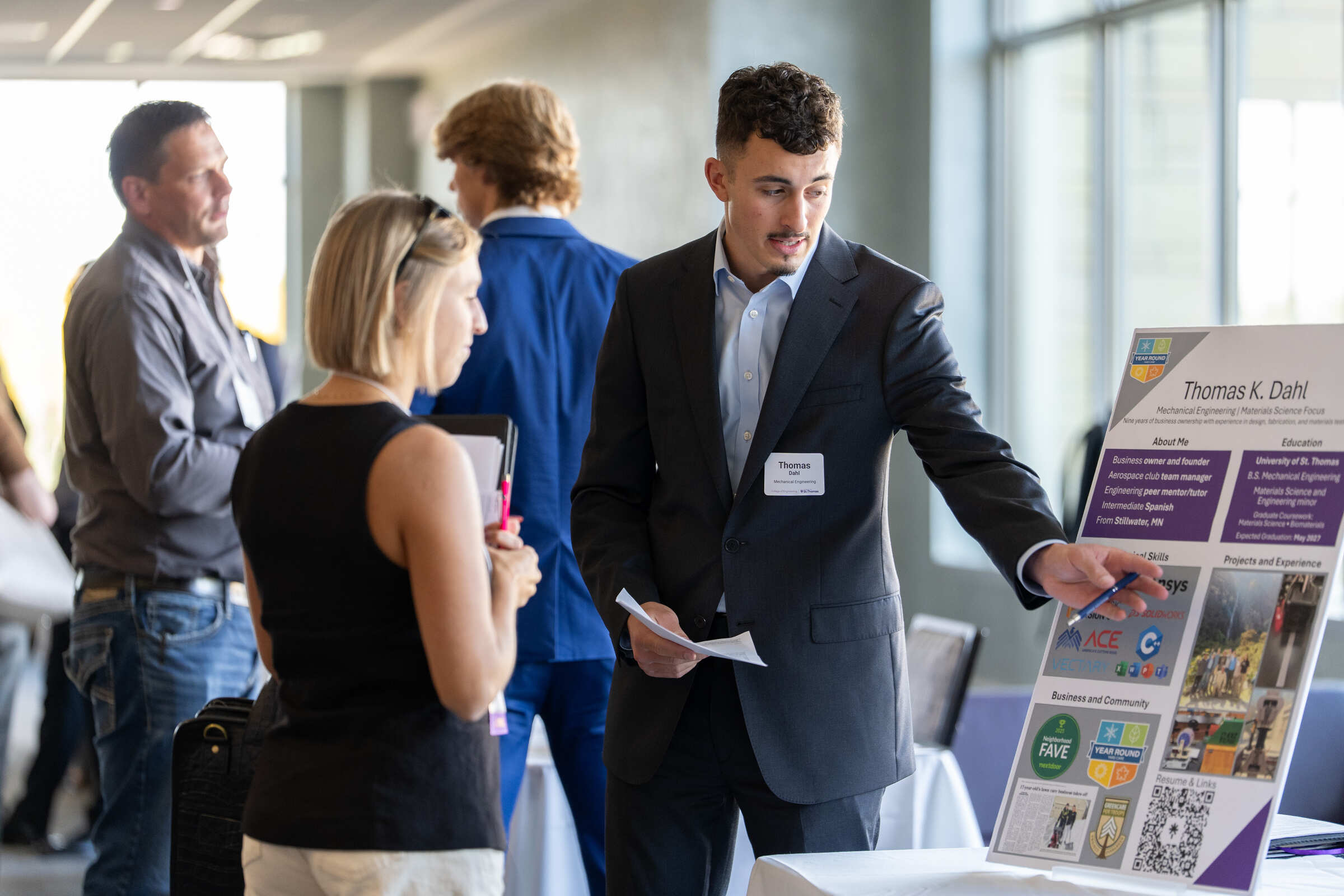 A student speaking with a recruiter.