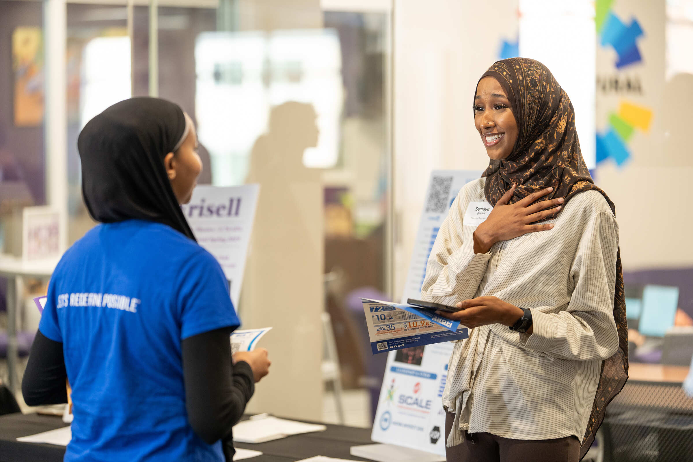 A student speaking with a recruiter at the reverse career fair.